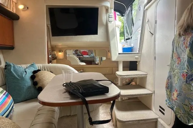 Slide: The Image of Interior of 2001 Sea Ray 340 Sundancer yacht with cozy seating and modern amenities. - 8