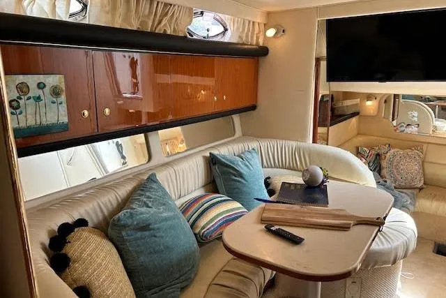 Slide: The Image of Interior of 2001 Sea Ray 340 Sundancer with cozy seating and modern decor. - 9