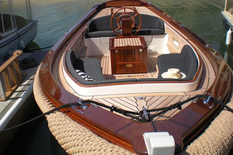 The Image of 2001 Wajer Captain's Launch 7m boat with elegant wood finish and seating area. - 1