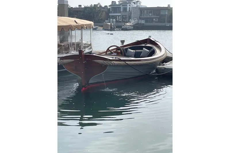Slide: The Image of 2001 Wajer Captain's Launch 7m boat docked on calm water. - 13