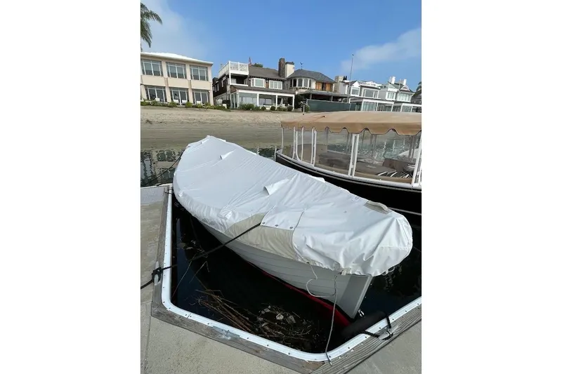 Slide: The Image of Covered 2001 Wajer Captain's Launch 7m docked near waterfront homes. - 20