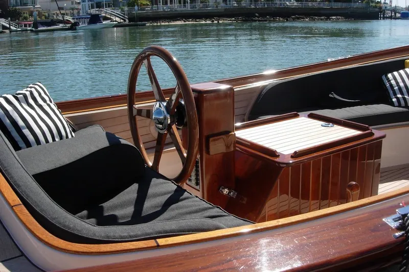 Slide: The Image of Luxurious 2001 Wajer Captain's Launch 7m with elegant wooden interior and striped cushions. - 6