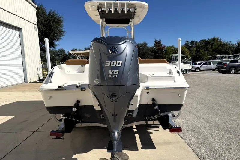 Slide: The Image of 2025 Key West 239 FS boat with Yamaha 300 V6 engine, parked outdoors. - 10
