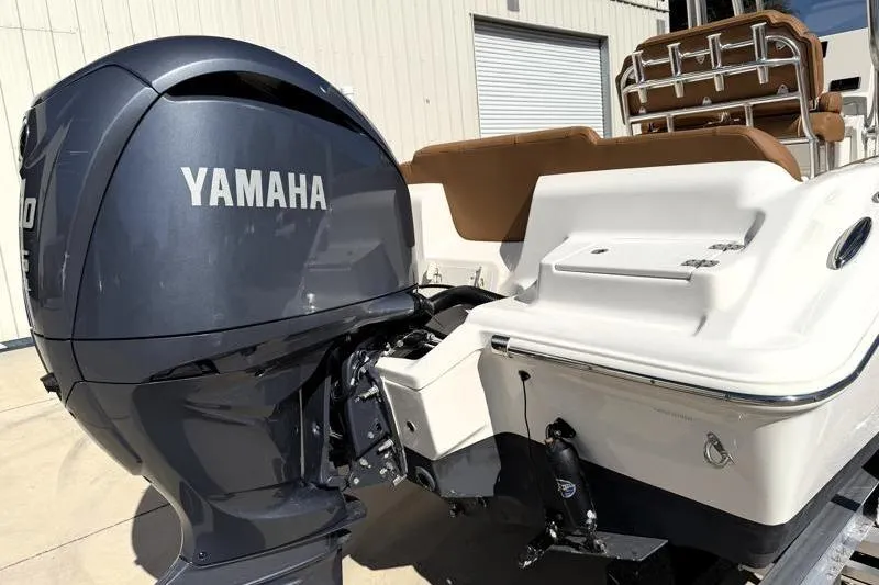 Slide: The Image of 2025 Key West 239 FS boat with Yamaha outboard motor, rear view. - 12