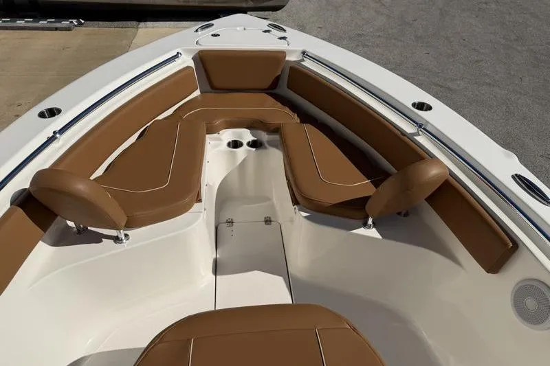 Slide: The Image of 2025 Key West 239 FS boat interior with brown cushioned seating. - 17
