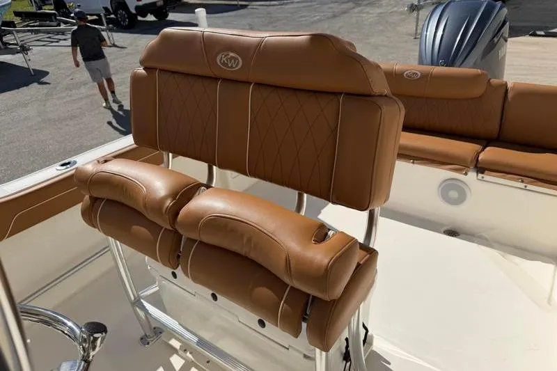 Slide: The Image of 2025 Key West 239 FS boat with tan leather seating and Yamaha engine. - 26