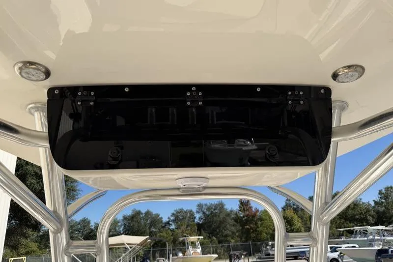 Slide: The Image of 2025 Key West 239 FS boat console with overhead storage and lighting. - 29