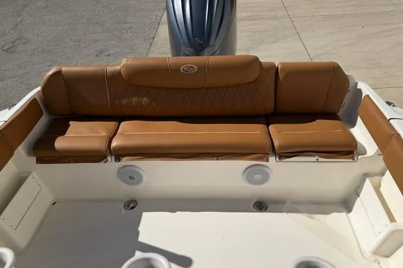 Slide: The Image of 2025 Key West 239 FS boat with tan leather seating and modern design. - 36