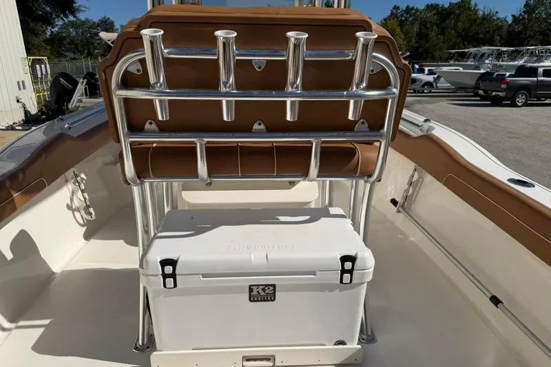 Slide: The Image of 2025 Key West 239 FS boat interior with rod holders and cooler. - 37
