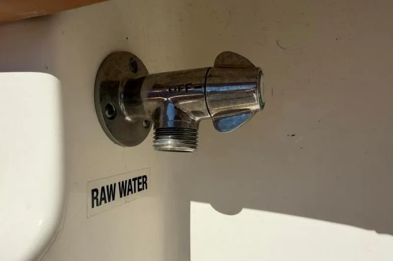 Slide: The Image of Raw water faucet on 2025 Key West 239 FS boat, labeled 'OFF' and 'RAW WATER'. - 41