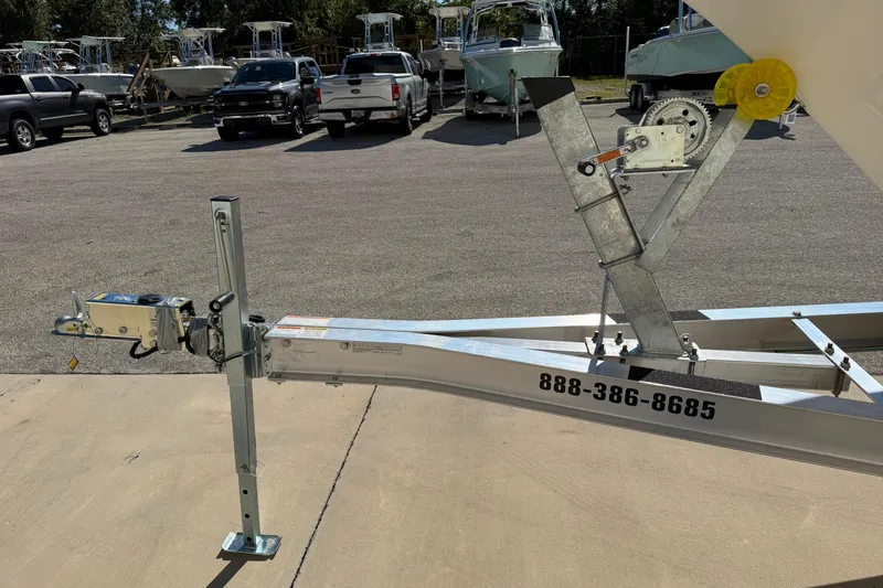 Slide: The Image of Trailer hitch and winch of a 2025 Key West 239 FS boat in a parking lot. - 42