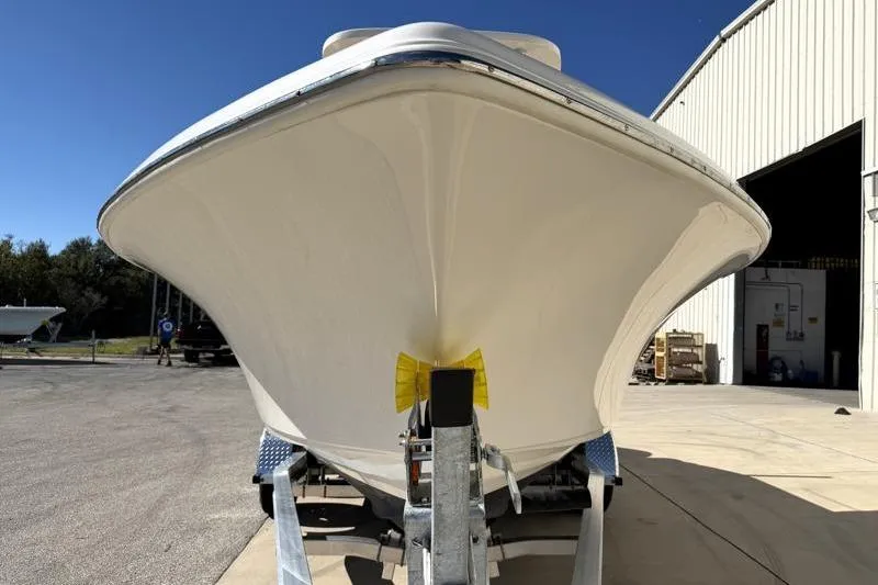 Slide: The Image of 2025 Key West 239 FS boat on trailer outside a warehouse. - 7