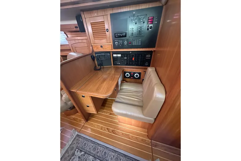 Slide: The Image of Interior of 2003 Catalina 470 yacht with navigation station and control panel. - 20