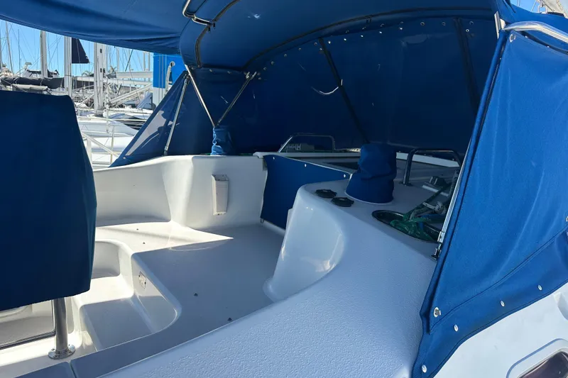 Slide: The Image of Cockpit of a 2003 Catalina 470 sailboat with blue canopy and seating. - 5