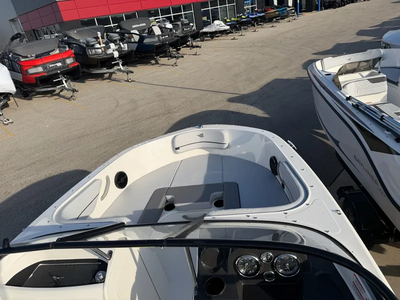 Slide: The Image of 2026 Bayliner VR4 Bowrider OB at a boat dealership lot. - 10
