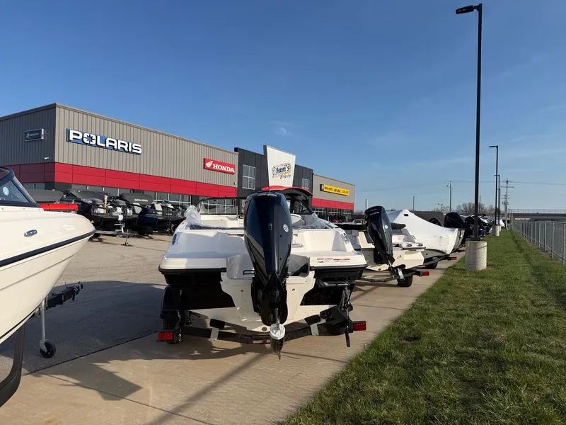 Slide: The Image of 2026 Bayliner VR4 Bowrider OB boats outside a dealership. - 4