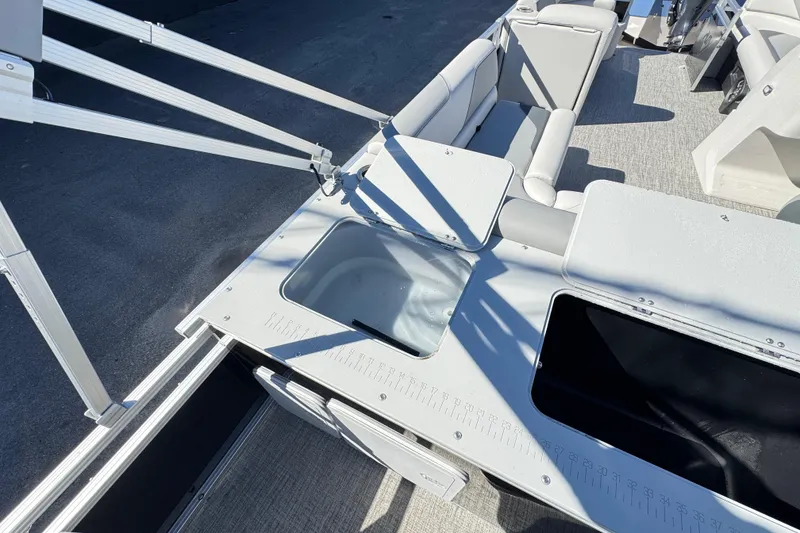 Slide: The Image of 2025 Avalon 2385 Rear Fish boat interior with seating and fishing station. - 11