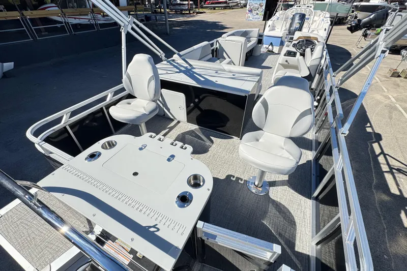 Slide: The Image of 2025 Avalon 2385 Rear Fish boat interior with seating and fishing setup. - 5