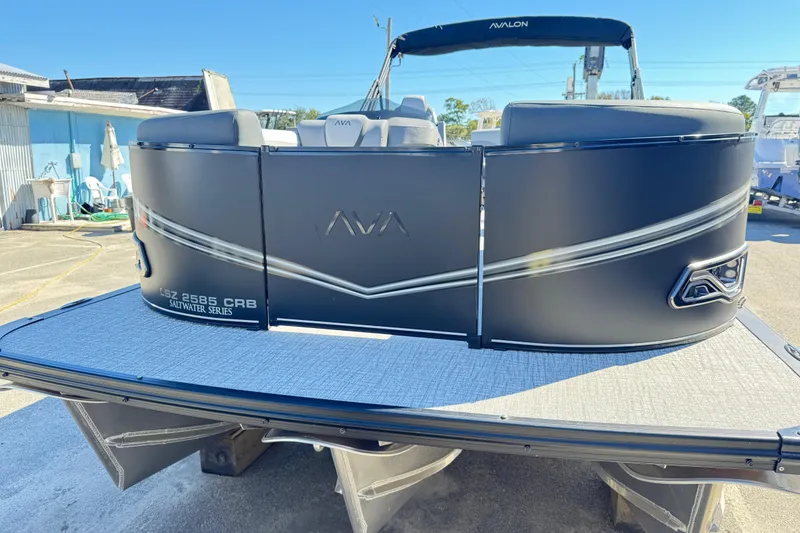 Slide: The Image of 2025 Avalon LSZ 2585 CRB pontoon boat, Saltwater Series, docked outdoors. - 3