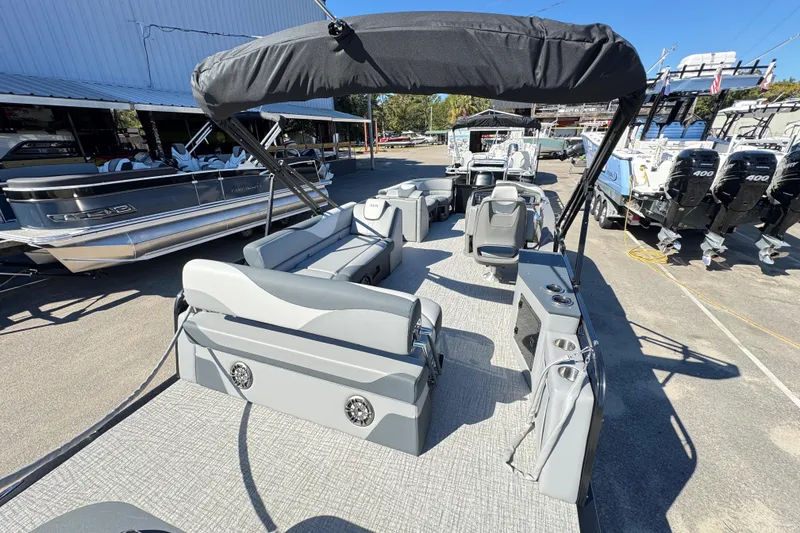 Slide: The Image of 2025 Avalon LSZ 2585 CRB pontoon boat with spacious seating and modern design. - 5