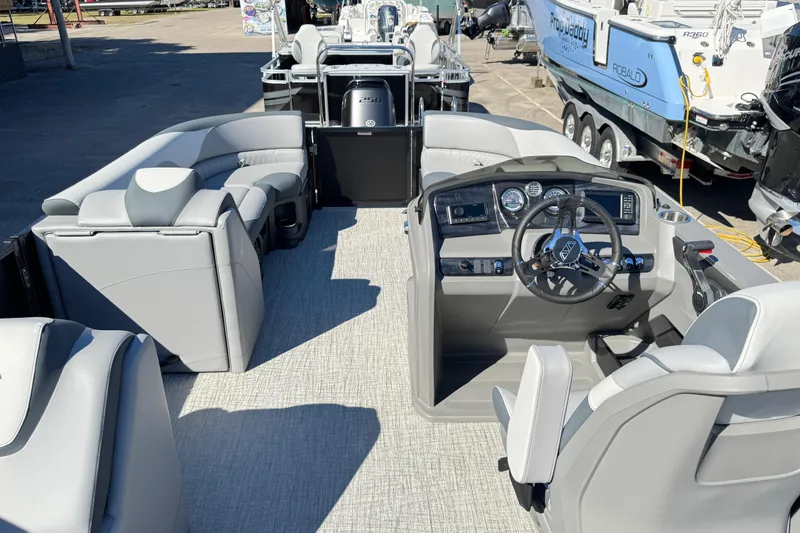 Slide: The Image of 2025 Avalon LSZ 2585 CRB pontoon boat interior with modern helm and seating. - 6