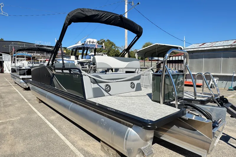 Slide: The Image of 2025 Avalon LSZ 2585 CRB pontoon boat with sleek design and modern features. - 9