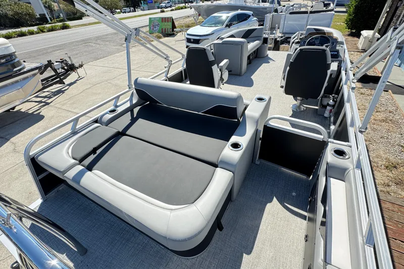 Slide: The Image of 2025 Avalon Venture 2385 VRB pontoon boat with spacious seating and modern design. - 3