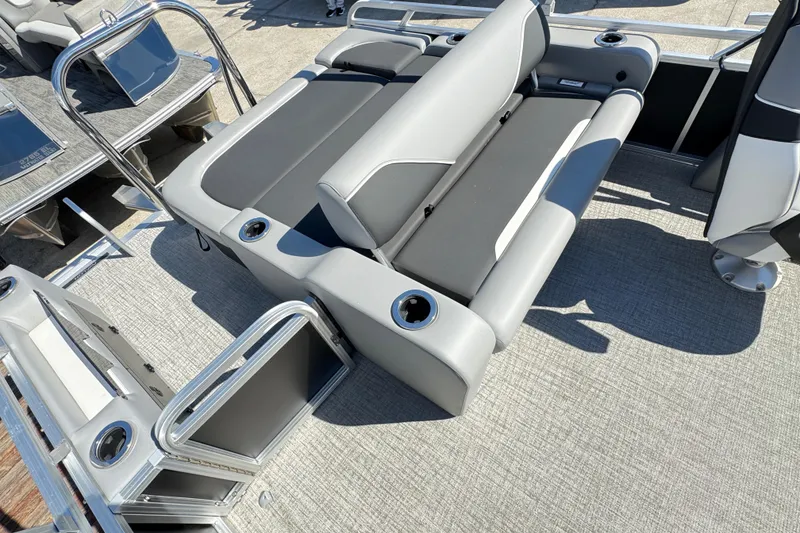 Slide: The Image of 2025 Avalon Venture 2385 VRB pontoon boat with gray seating and cup holders. - 5