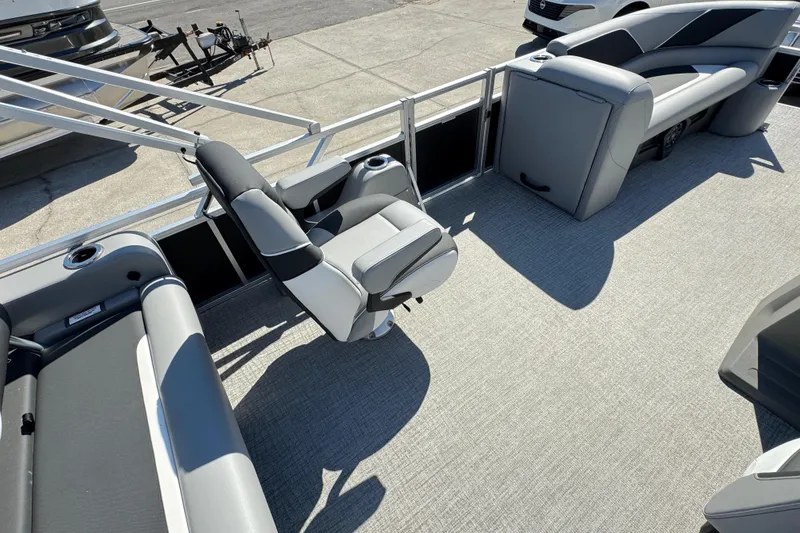 Slide: The Image of 2025 Avalon Venture 2385 VRB pontoon boat interior with gray seating and carpet. - 8