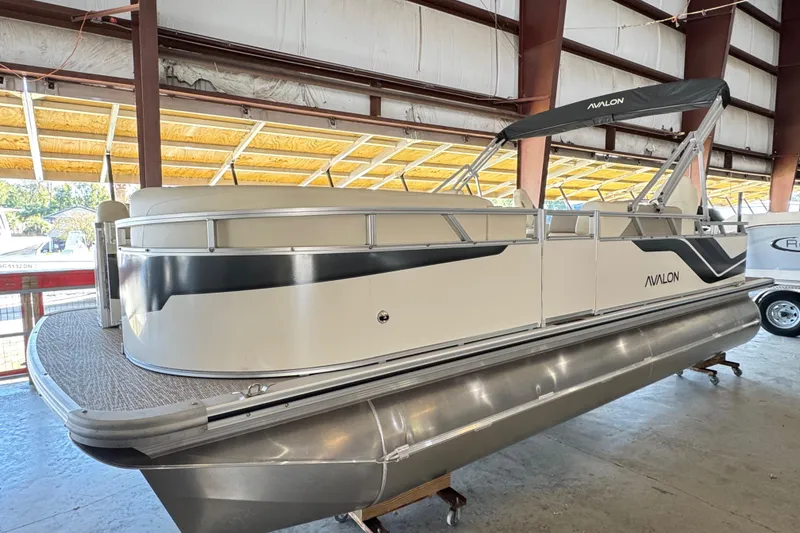 The Image of 2025 Avalon 2185 Rear Fish pontoon boat in a covered storage area. - 1