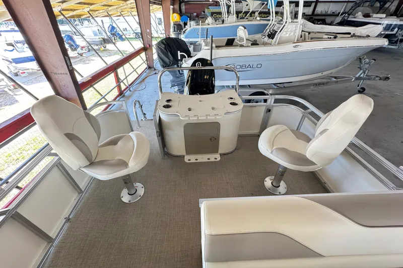 Slide: The Image of 2025 Avalon 2185 Rear Fish boat interior with swivel seats and fishing station. - 10