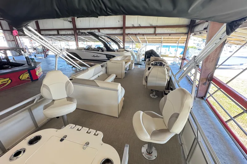 Slide: The Image of 2025 Avalon 2185 Rear Fish boat interior with seating and helm station. - 6