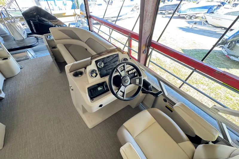 Slide: The Image of 2025 Avalon 2185 Rear Fish boat interior with steering console and seating. - 7