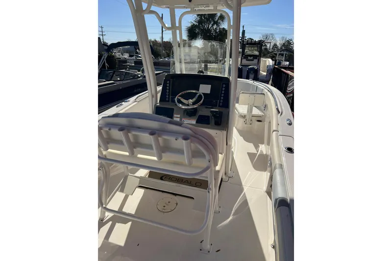 Slide: The Image of 2023 Robalo R230 Center Console boat interior with steering wheel and seating. - 5