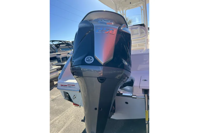 Slide: The Image of 2023 Robalo R230 Center Console with powerful outboard motor, rear view. - 6