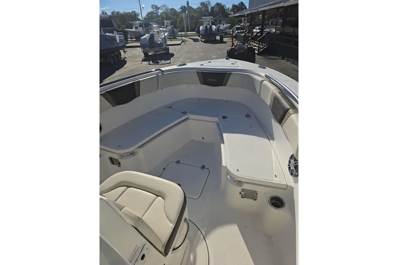 Slide: The Image of 2021 Robalo R230 Center Console boat interior with seating and storage compartments. - 10