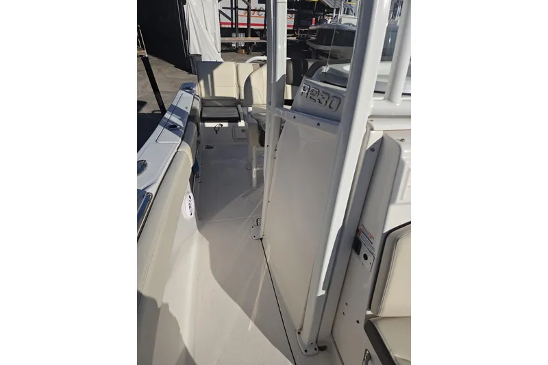 Slide: The Image of 2021 Robalo R230 Center Console boat interior with seating and console details. - 11