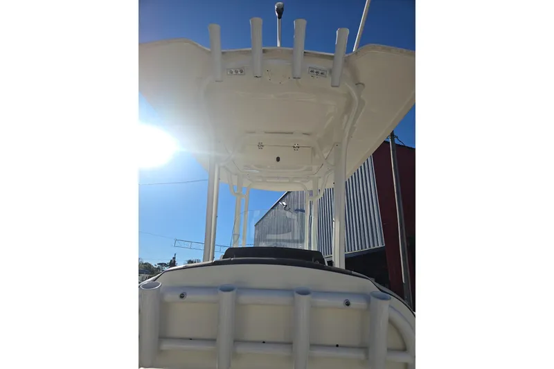 Slide: The Image of 2021 Robalo R230 Center Console boat with T-top under bright sunlight. - 16