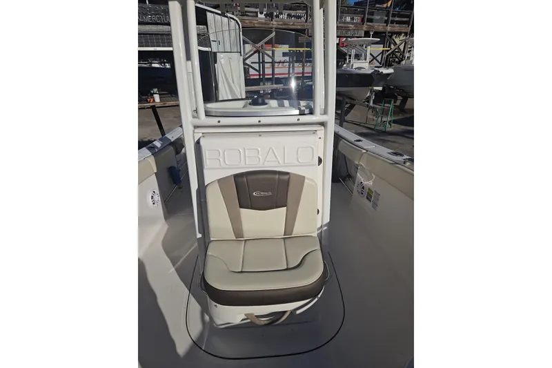 Slide: The Image of 2021 Robalo R230 Center Console boat interior with cushioned seating. - 9