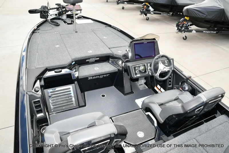 Slide: The Image of 2023 Ranger Z520R boat interior with advanced dashboard and seating. - 11