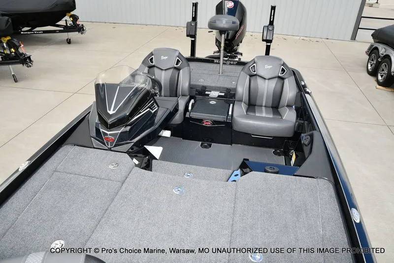 Slide: The Image of 2023 Ranger Z520R boat interior with dual seats and sleek dashboard design. - 15