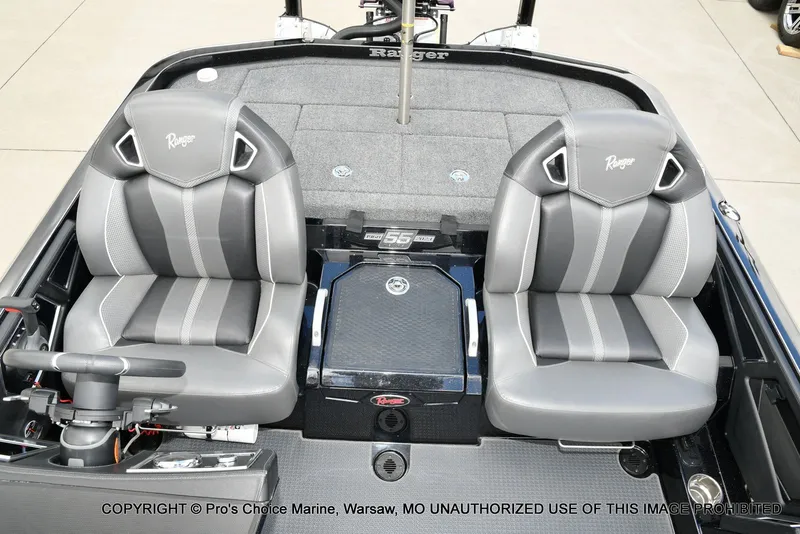 Slide: The Image of 2023 Ranger Z520R boat interior with dual gray seats and steering console. - 16