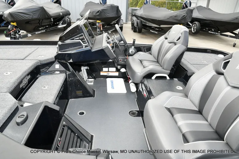 Slide: The Image of 2023 Ranger Z520R boat interior with sleek seating and modern dashboard design. - 19