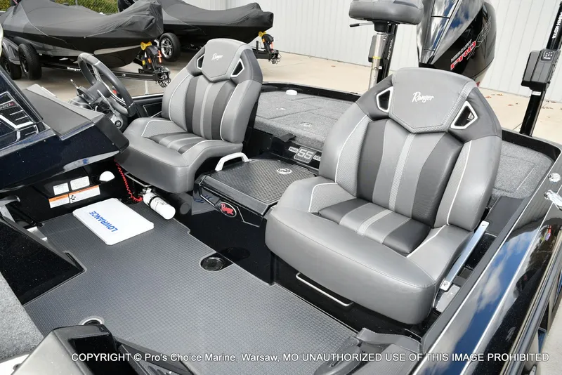 Slide: The Image of 2023 Ranger Z520R boat interior with dual gray seats and modern dashboard. - 20