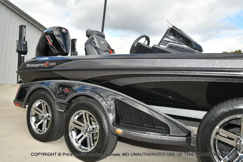 Slide: The Image of 2023 Ranger Z520R boat with sleek design and shiny chrome wheels. - 21