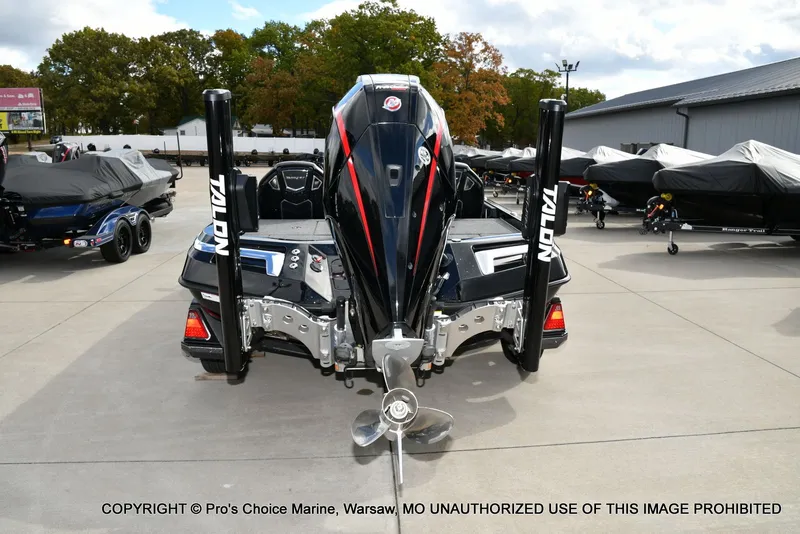 Slide: The Image of 2023 Ranger Z520R boat with Talon anchors, displayed outdoors on concrete. - 28