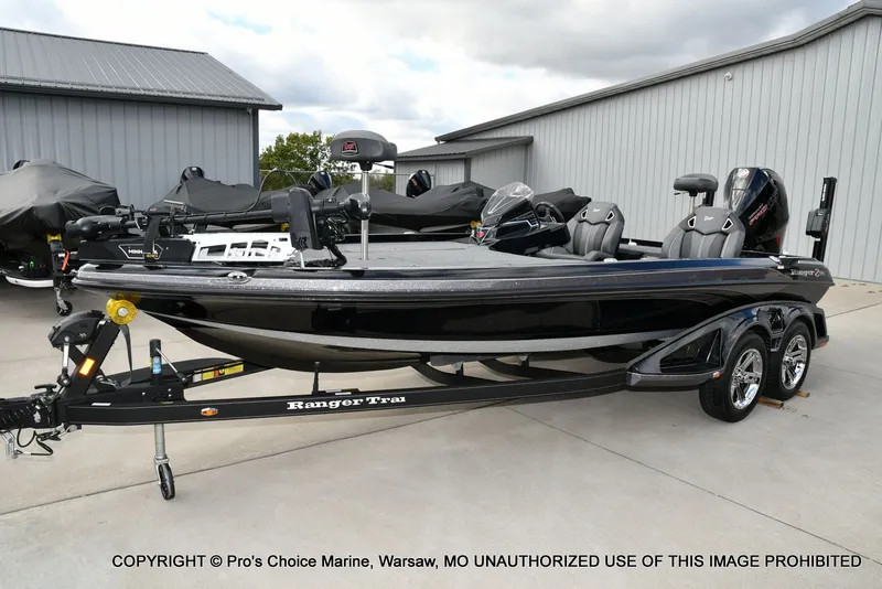 Slide: The Image of 2023 Ranger Z520R bass boat on trailer, parked outdoors. - 31