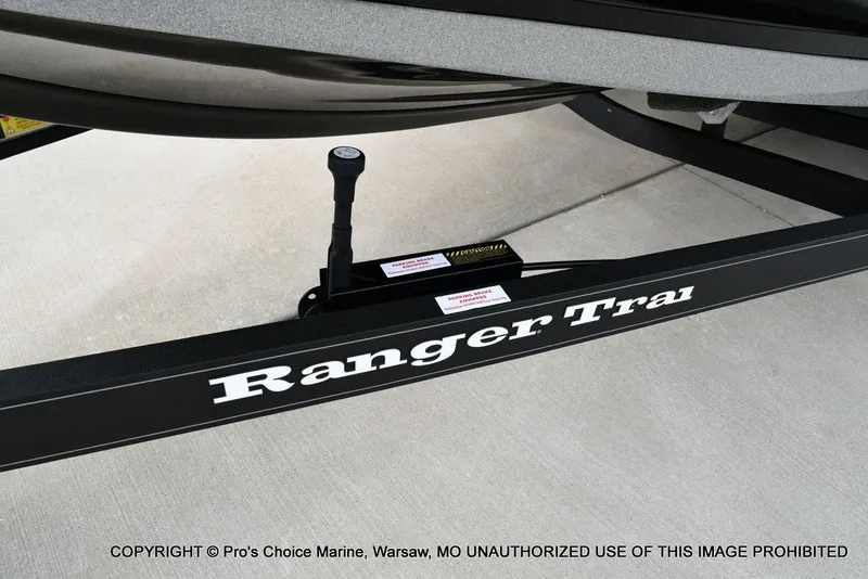 Slide: The Image of 2023 Ranger Z520R boat trailer with parking brake on concrete surface. - 35