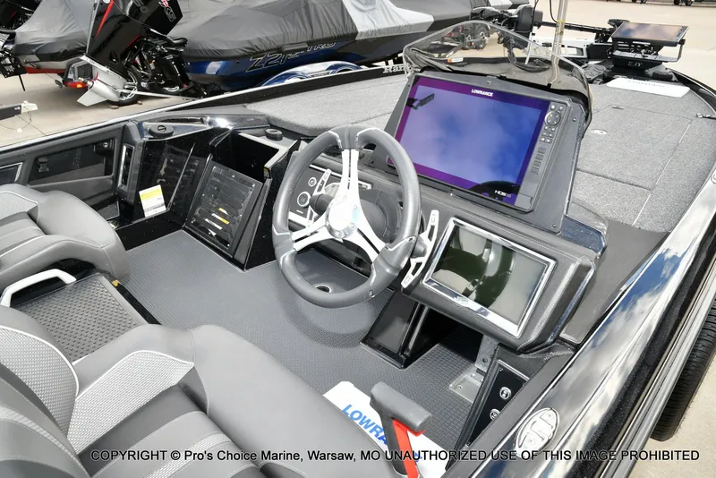 Slide: The Image of 2023 Ranger Z520R boat interior with advanced navigation system and steering wheel. - 42