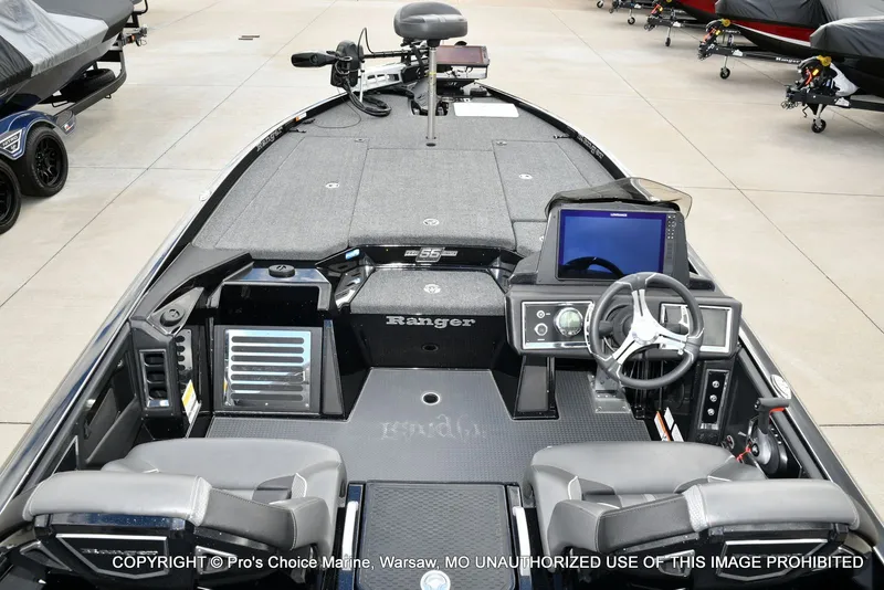 Slide: The Image of 2023 Ranger Z520R boat interior with steering wheel and control panel. - 46